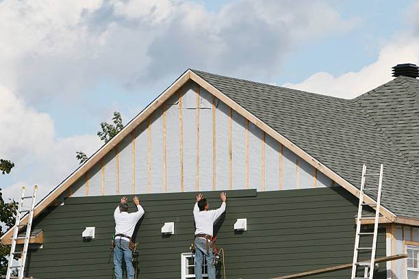 Professional Storm Damage Siding Repair technician working in Hebron, KY